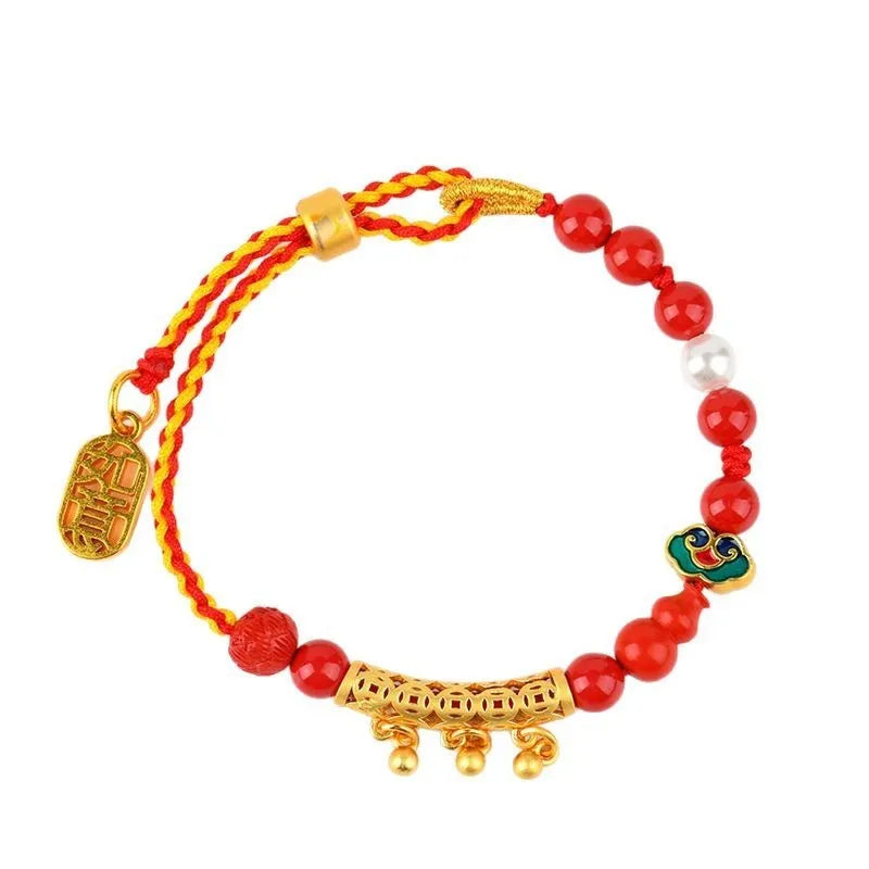 Red rope woven bracelet with round cinnabar charm and small bell for women