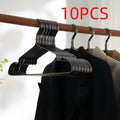 Elegant black modern clothes hanger with non-slip surface for secure garment storage