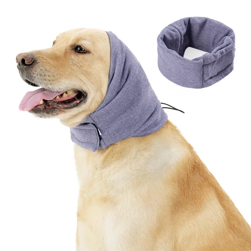Dog wearing purple calming hoodie with ear muffs covering head and neck