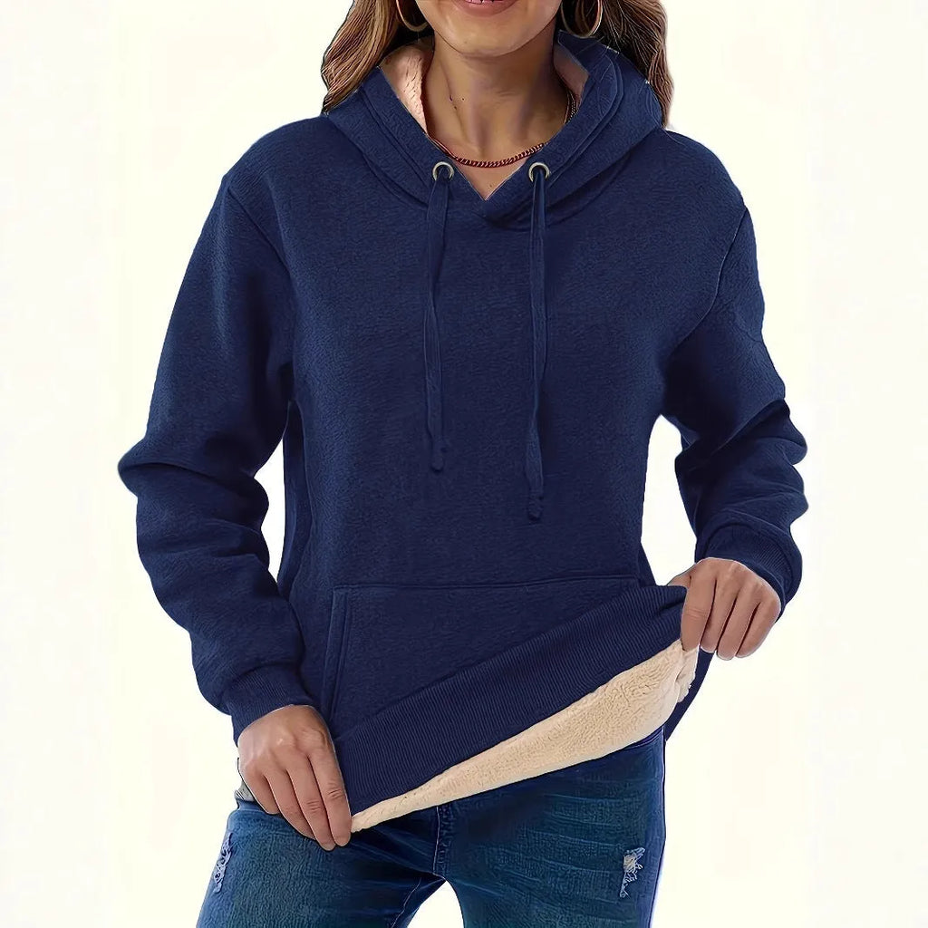 Women's black hooded sweater with a textured 3D pattern, loose fit, and front pockets.