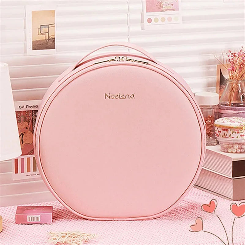 Round pink smart LED makeup bag with mirror lights open, showing internal partitions and adjustable lighting.