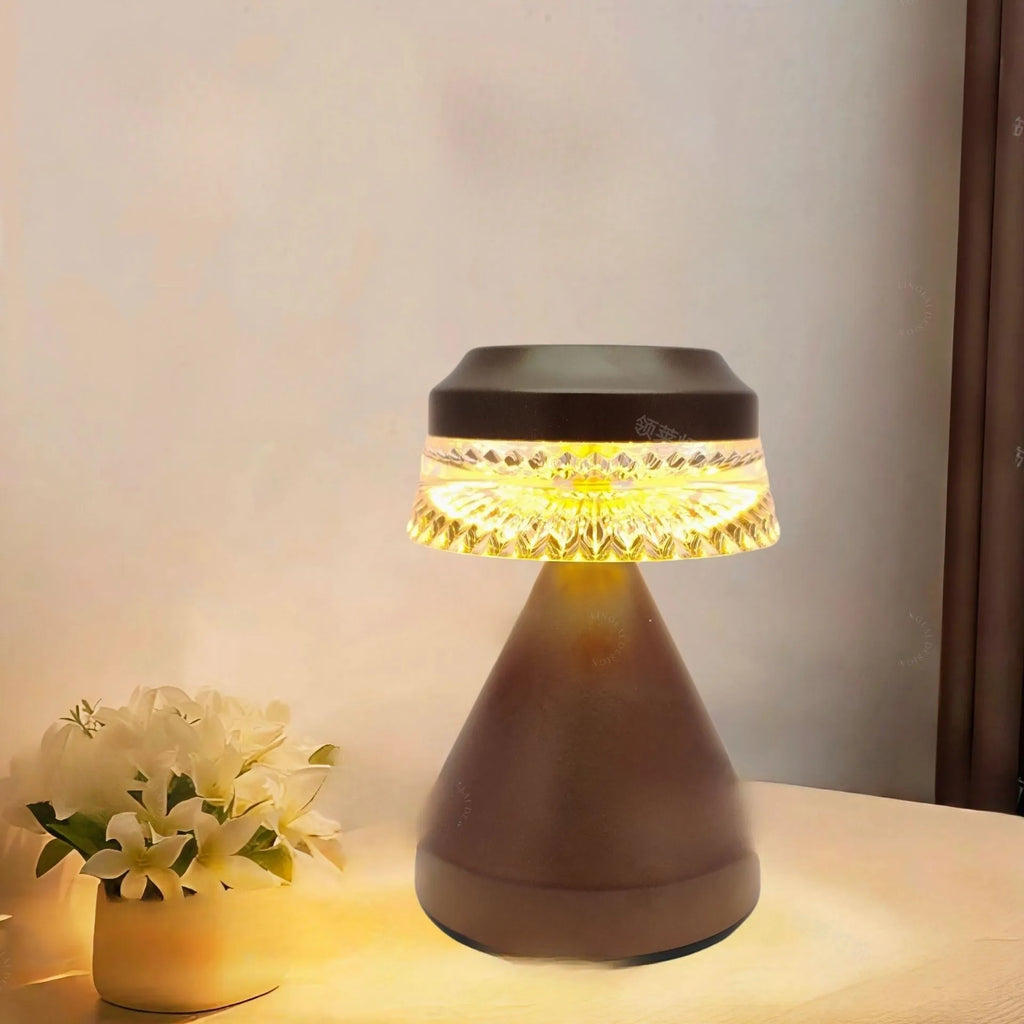 Creative LED charging night lamp with touch dimming controls in black finish on bedside table