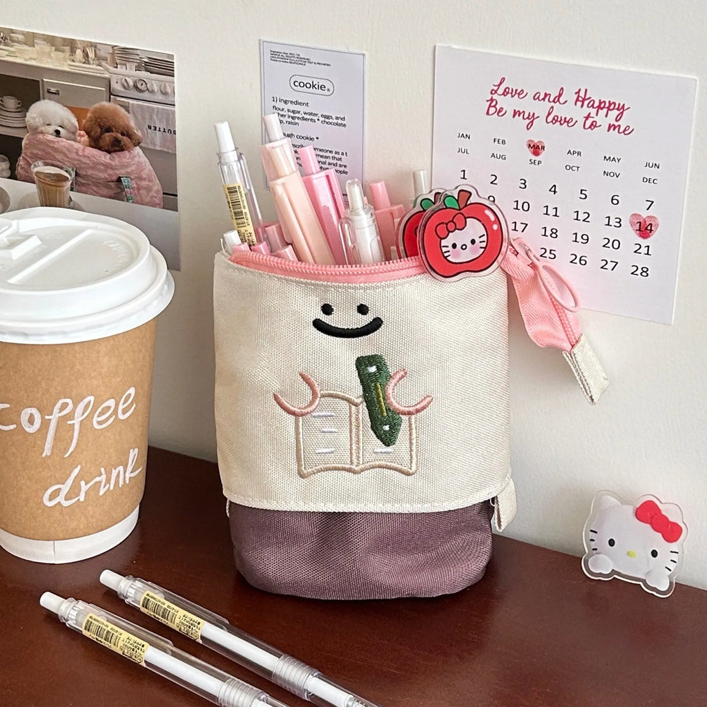 Brown collapsible pencil case with Korean-style cartoon design showing 17x14cm dimensions and Oxford fabric texture