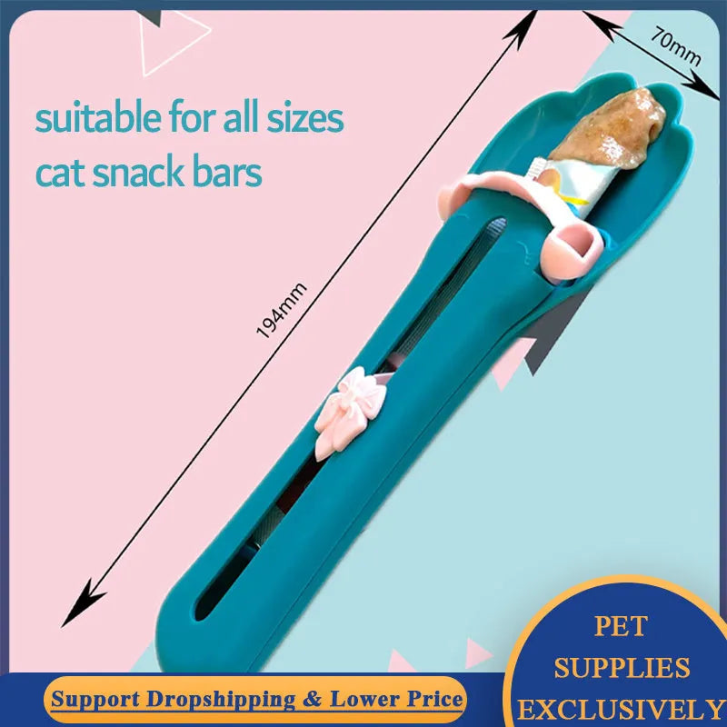 Green and pink pet feed spoon with extrusion design for dispensing cat treats and liquid food