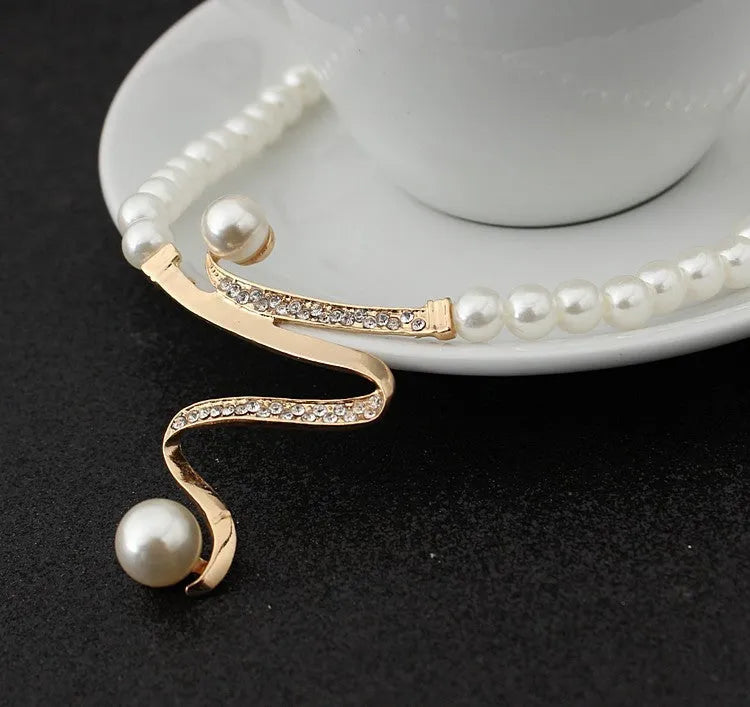 Gold electroplated pearl necklace and earrings jewellery suite with deep V clavicle design