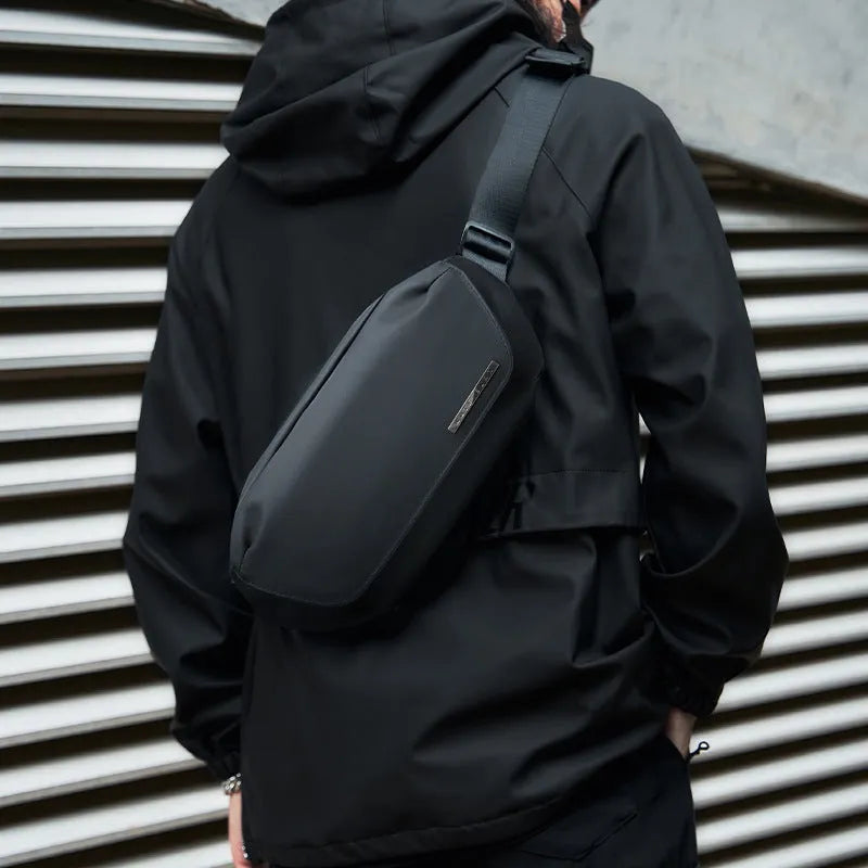 Black men's messenger bag with cross-body strap, Oxford cloth exterior, and street-trend design