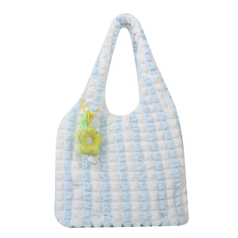 Soft square polyester shoulder bag with pleated bubble texture and an optional pendant, shown in multiple colours.