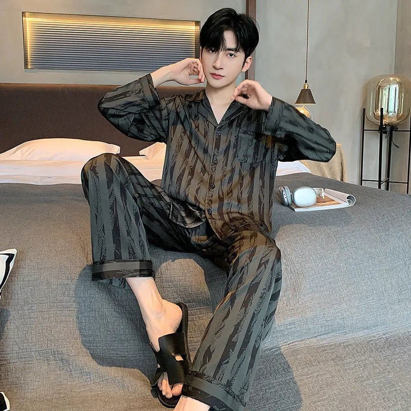 Men's black striped ice silk pajama two-piece set with V-neck top and long trousers.