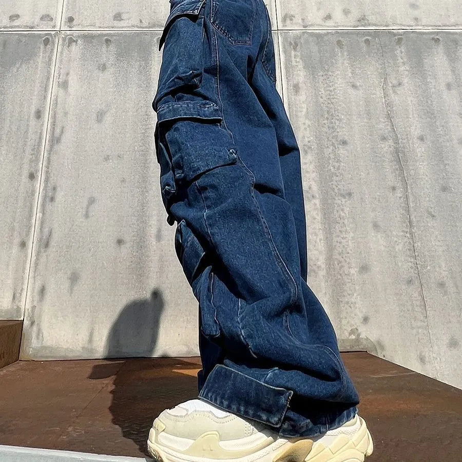 Dark blue distressed wide-leg women's jeans with a high waist and multiple pockets on a mannequin.