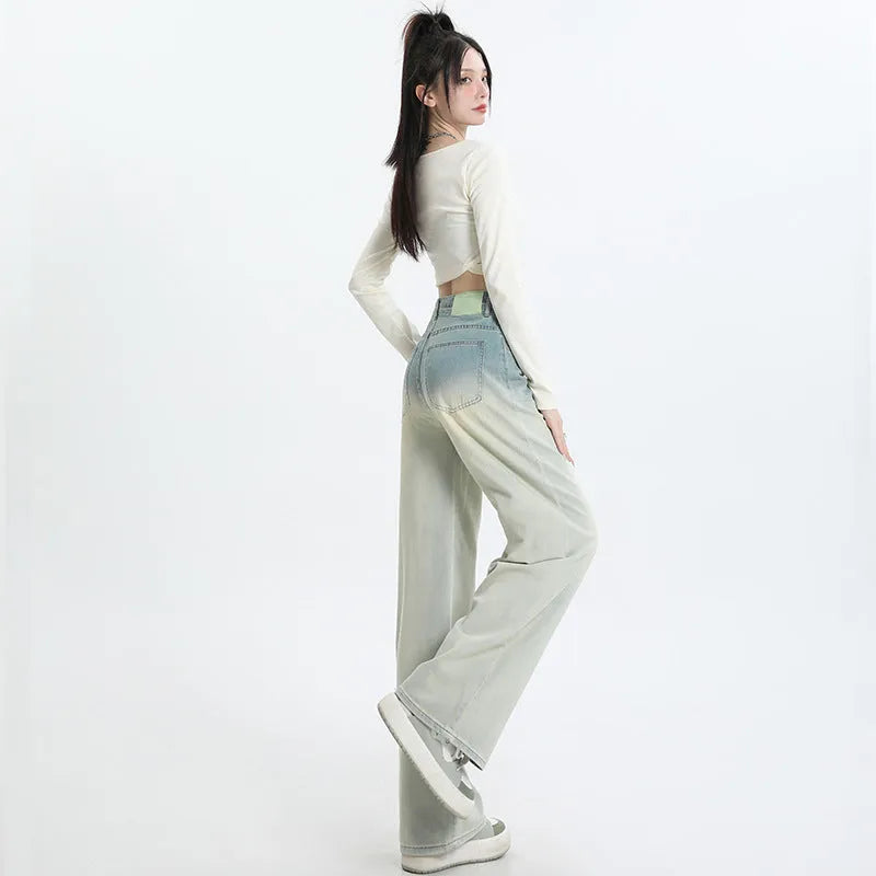 Women's gradient blue straight-leg denim trousers showing colour transition and straight cut silhouette