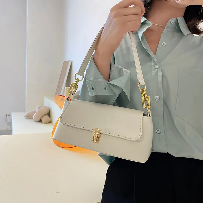 French casual brown PU underarm shoulder bag with chain strap and horizontal square sandwich pocket design.