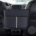 Black leather car seat storage bag with carbon fibre pattern, 38cm long, placed in middle of car seat
