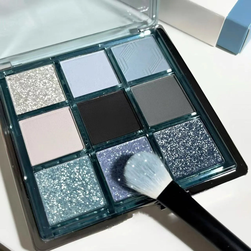 MUGELEEN nine-colour eye shadow palette showing low saturation ice permeable blue and smoked shades with matte and shimmer textures