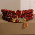 Red cinnabar bracelet with geometric gourd and flower design, 6mm diameter with clasp fastening