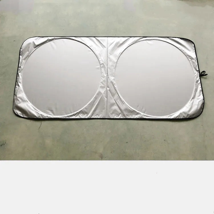 Silver reflective car sunshade measuring 190cm by 90cm folded in its cloth storage bag