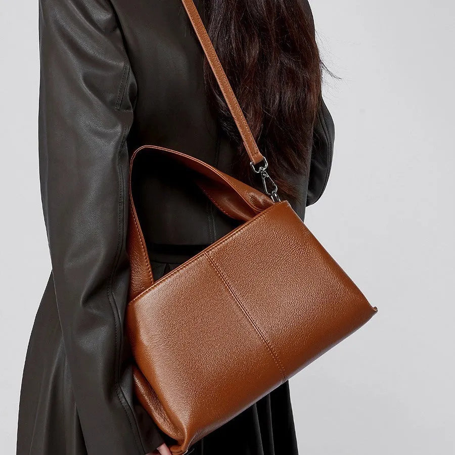 Women's genuine leather messenger bag in horizontal square shape with double shoulder straps and organised compartments
