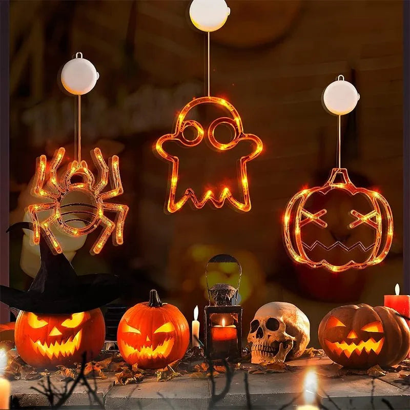 Halloween LED window lights set with spider, pumpkin and ghost designs on suction cups