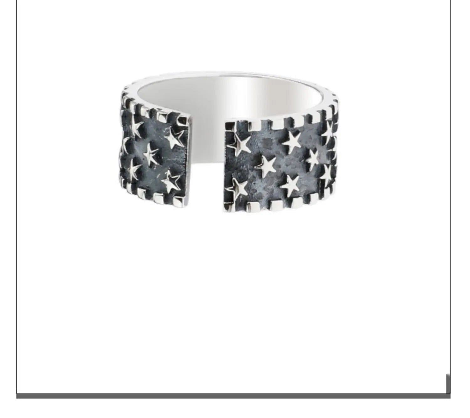Adjustable sterling silver ring with engraved five-pointed star geometry patterns on a hand