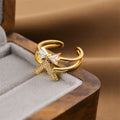 Gold electroplated copper ring with geometric open design, adjustable for personalised fit