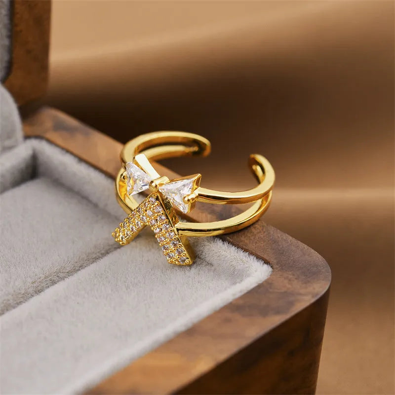 Gold electroplated copper ring with geometric open design, adjustable for personalised fit