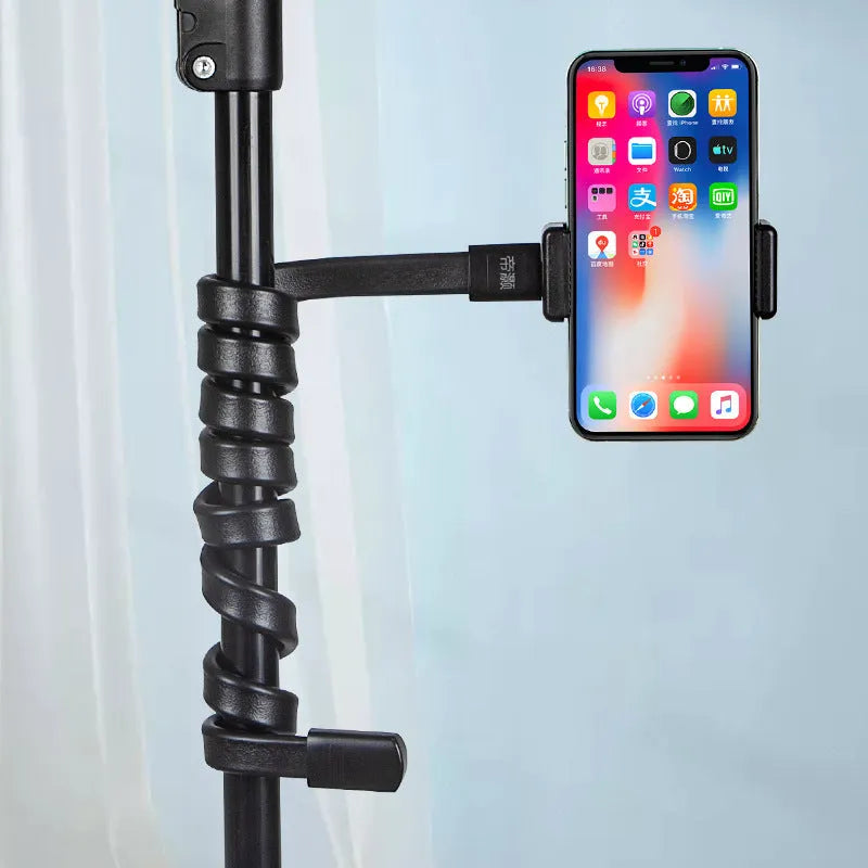Flexible silicone and aluminium adjustable hose phone holder bent into an S-shape with smartphone attached.