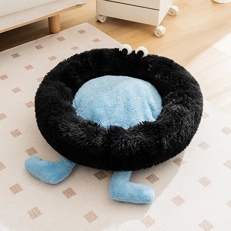 Blue plush kennel-style dog bed with raised sides, shown on a wooden floor.