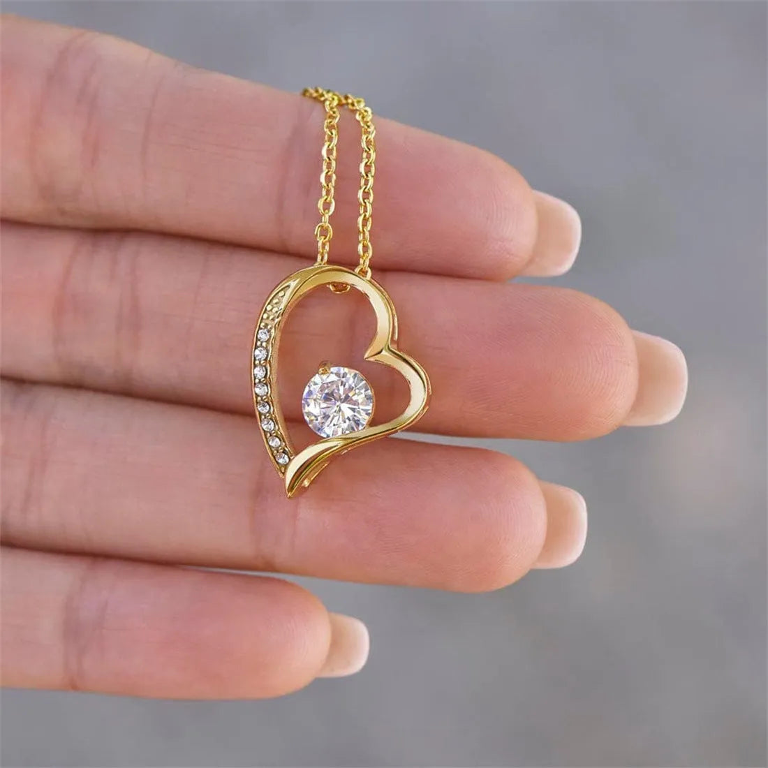 Hollow heart-shaped pendant necklace in silver or gold with gift box and card.