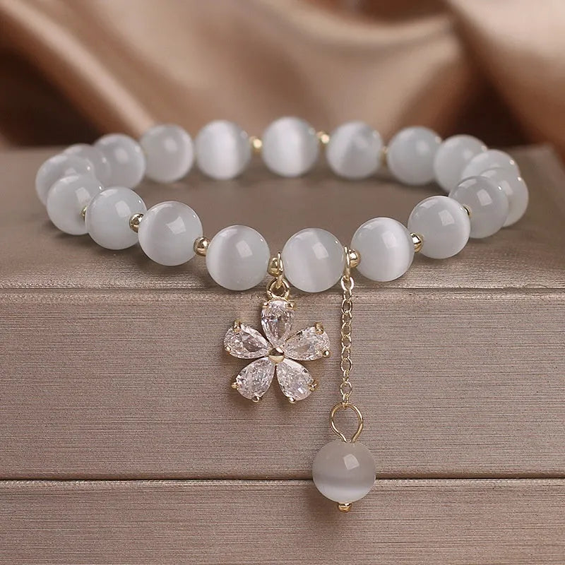 White cat's eye crystal women's bracelet with morganite safety buckle pendant and small flower tassel