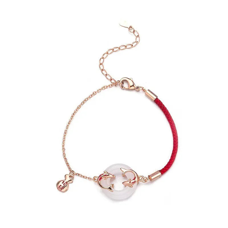 Women's red rope festive koi bracelet with peace buckle fastening and fishtail detailing