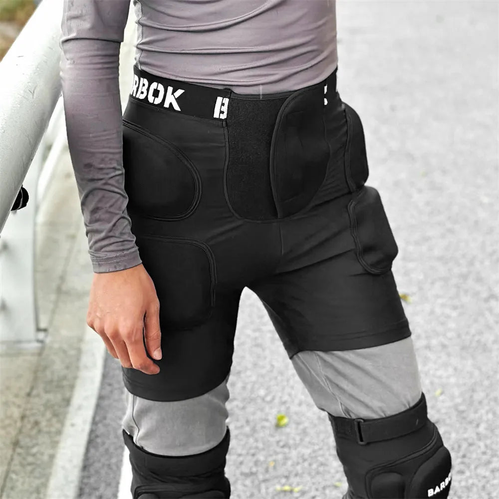 Black skating hip protection pants with integrated NBR foam pads for impact absorption during falls