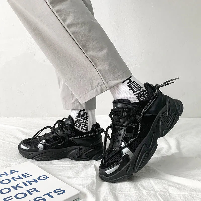 Men's white platform trainers with lace-up front and a breathable mesh lining, shown from the side.