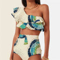 White women's one-shoulder swimsuit with large lotus leaf design and side split, double-layer front for coverage.