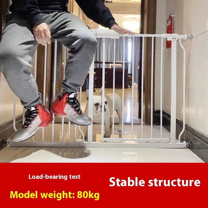 White plastic baby safety gate installed at top of stairs with 78cm height and adjustable width mechanism