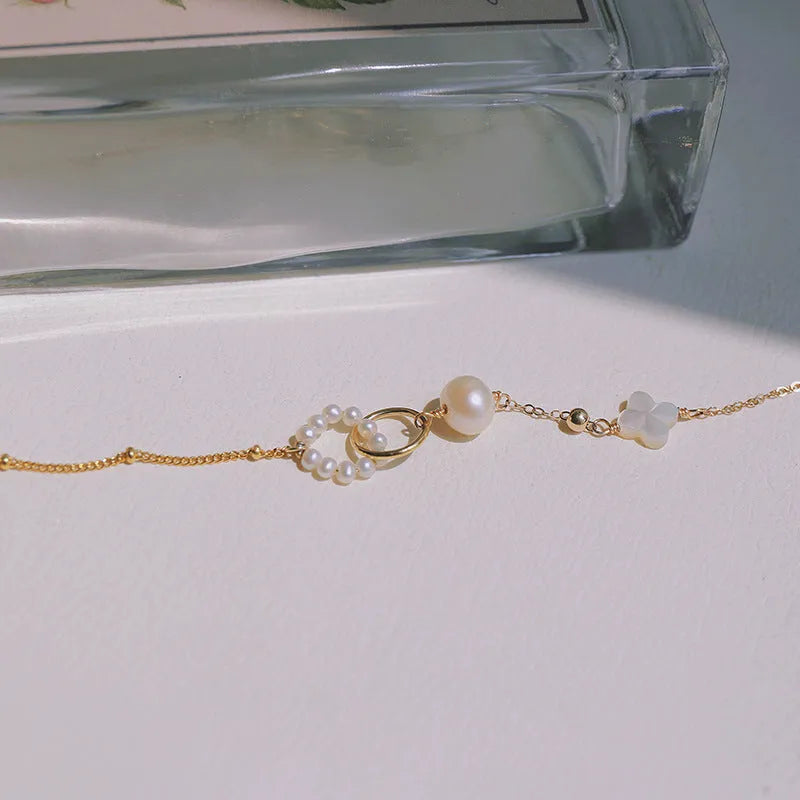 14k gold-plated natural pearl bracelet for women showing pearl and metallic elements
