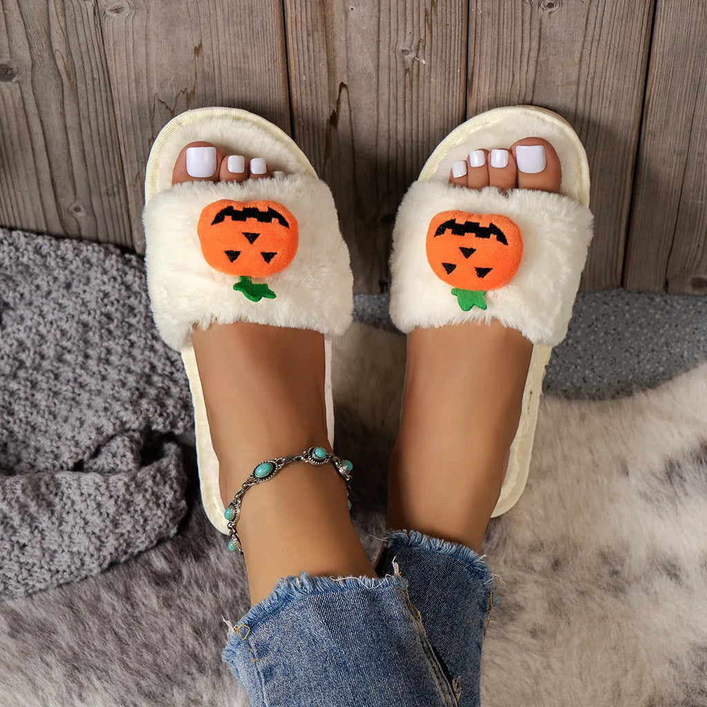 Halloween pumpkin plush slippers with open toe design showing synthetic fur uppers and PVC soles