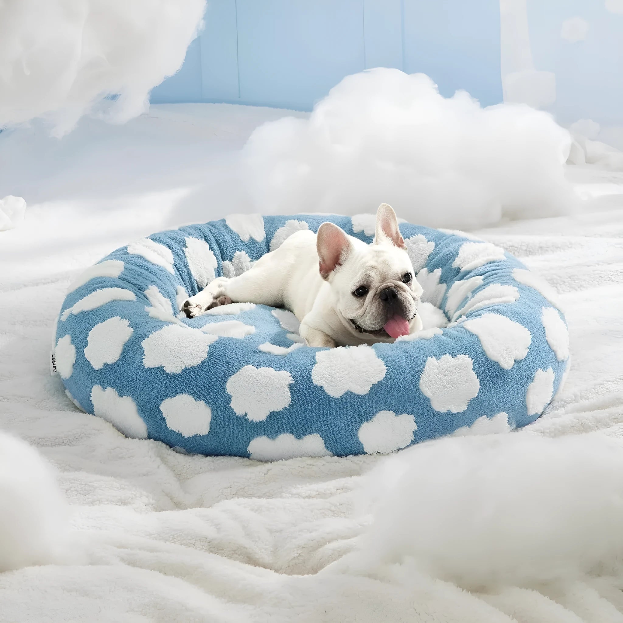 Round plastic dog bed with a blue and white plaid removable cover, shown in a 60x60cm size.