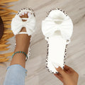 Women's leopard print beach slippers with thick sole and round toe in black and white options