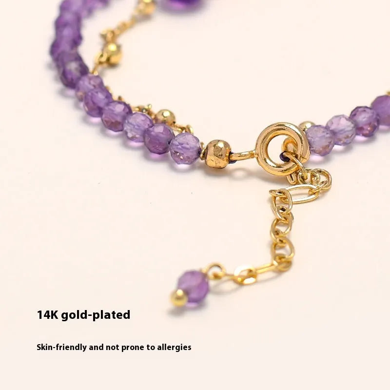 Amethyst crystal bracelet with diamond-shaped stones, adjustable chain, and Chinese-style clasp on wrist