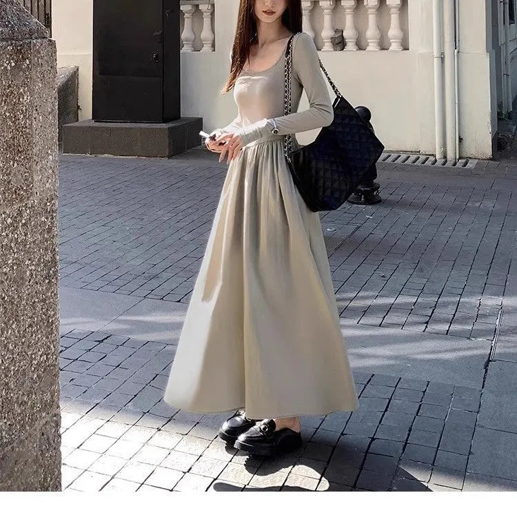 Women's black square collar knitted dress with elastic waist and long A-line skirt, made from polyester fabric.
