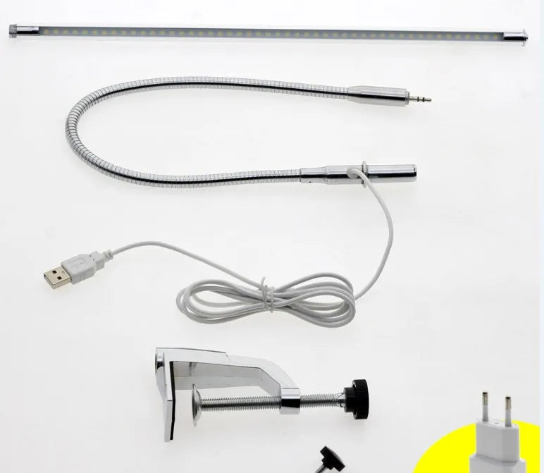 Silver aluminium alloy USB LED nail lamp with long arm and clip-on base, lit with bright white light.