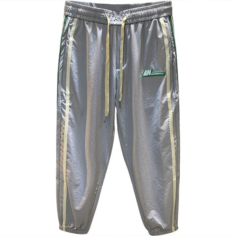 A pair of men's grey ice silk harem pants with a loose, casual fit and mid-waist design.