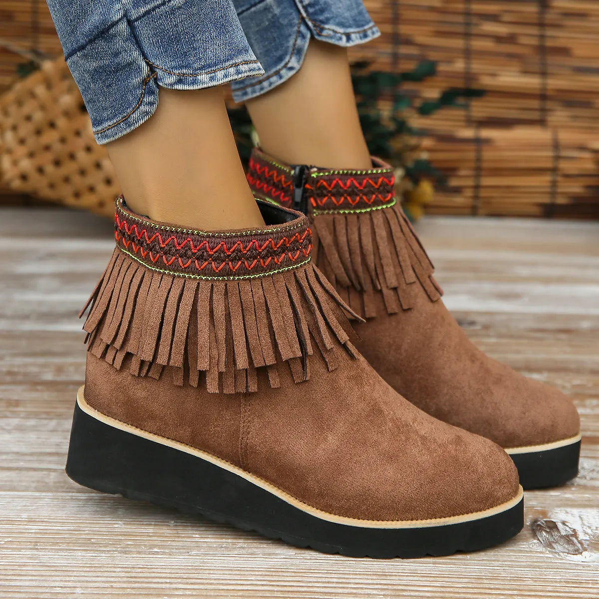 Women's suede wedge bootie in dark brown with side zipper and tassel detail on a 4cm rubber sole
