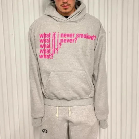 Man's black hooded sweater with a white letter print design on the front.