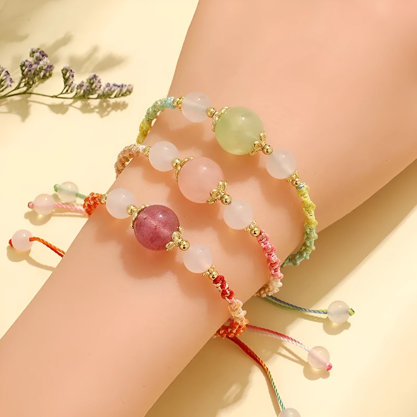 Hand-woven women's bracelet with white agate and a choice of strawberry quartz, pink crystal, or prehnite centre bead.
