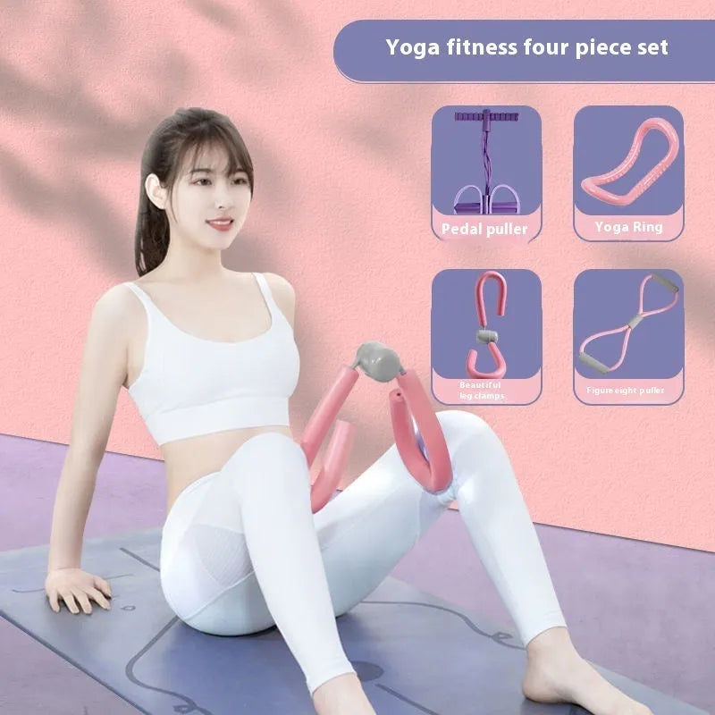 Yoga four piece set with leg stretching device, yoga ring, pedal tensioner, and figure eight tension rope on a mat