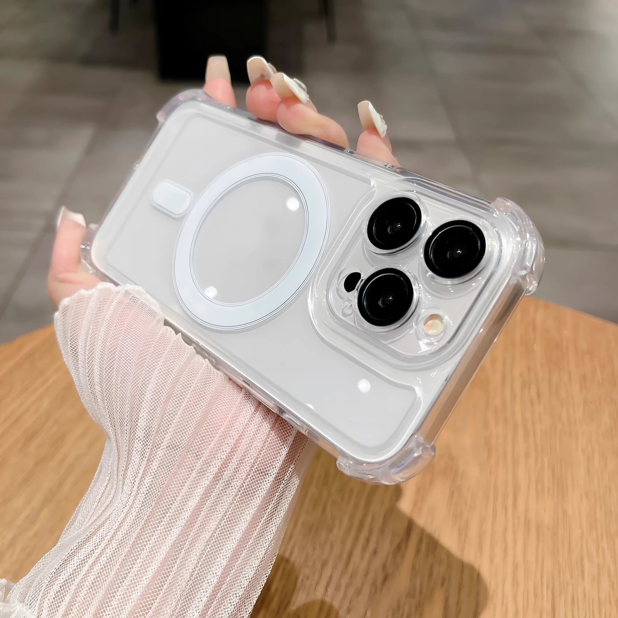 Transparent airbag silicone phone case for iPhone with built-in camera lens protector.