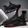 Black low-top mesh running sneakers with rubber sole, showing breathable construction and lace-up front