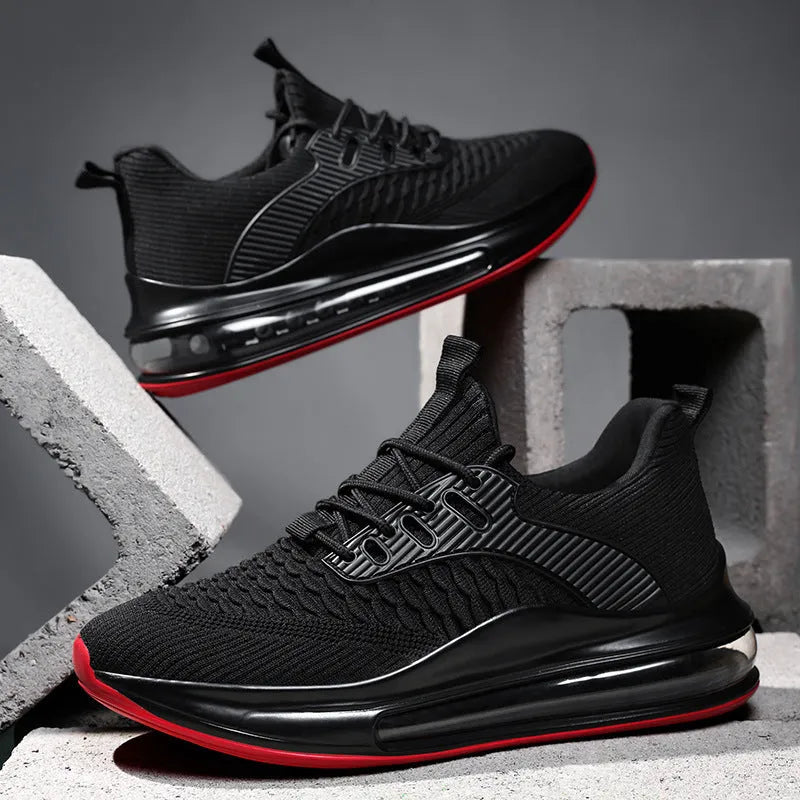 Black low-top mesh running sneakers with rubber sole, showing breathable construction and lace-up front