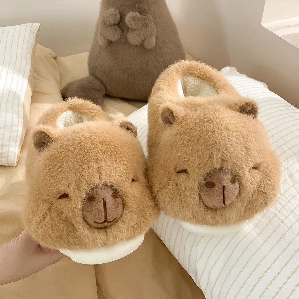 Light brown women's fleece slippers with a cartoon pattern, artificial wool lining, and a PVC sole.
