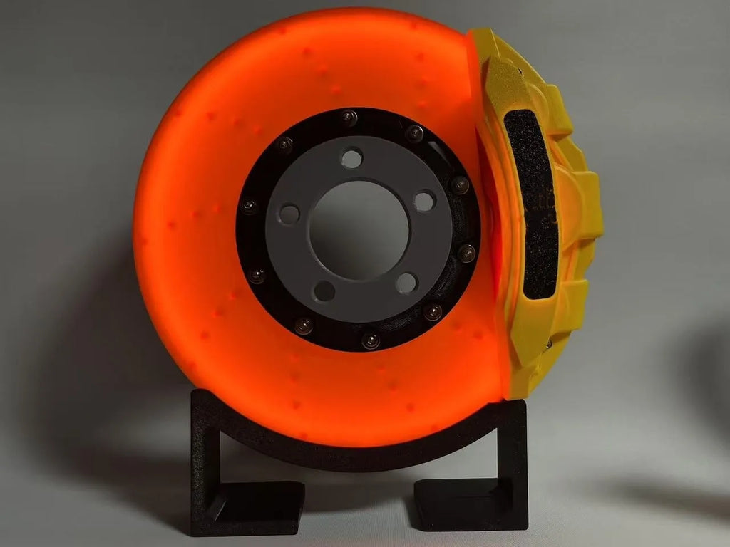 Blue brake disc LED rechargeable night light with touch dimmer on a desktop